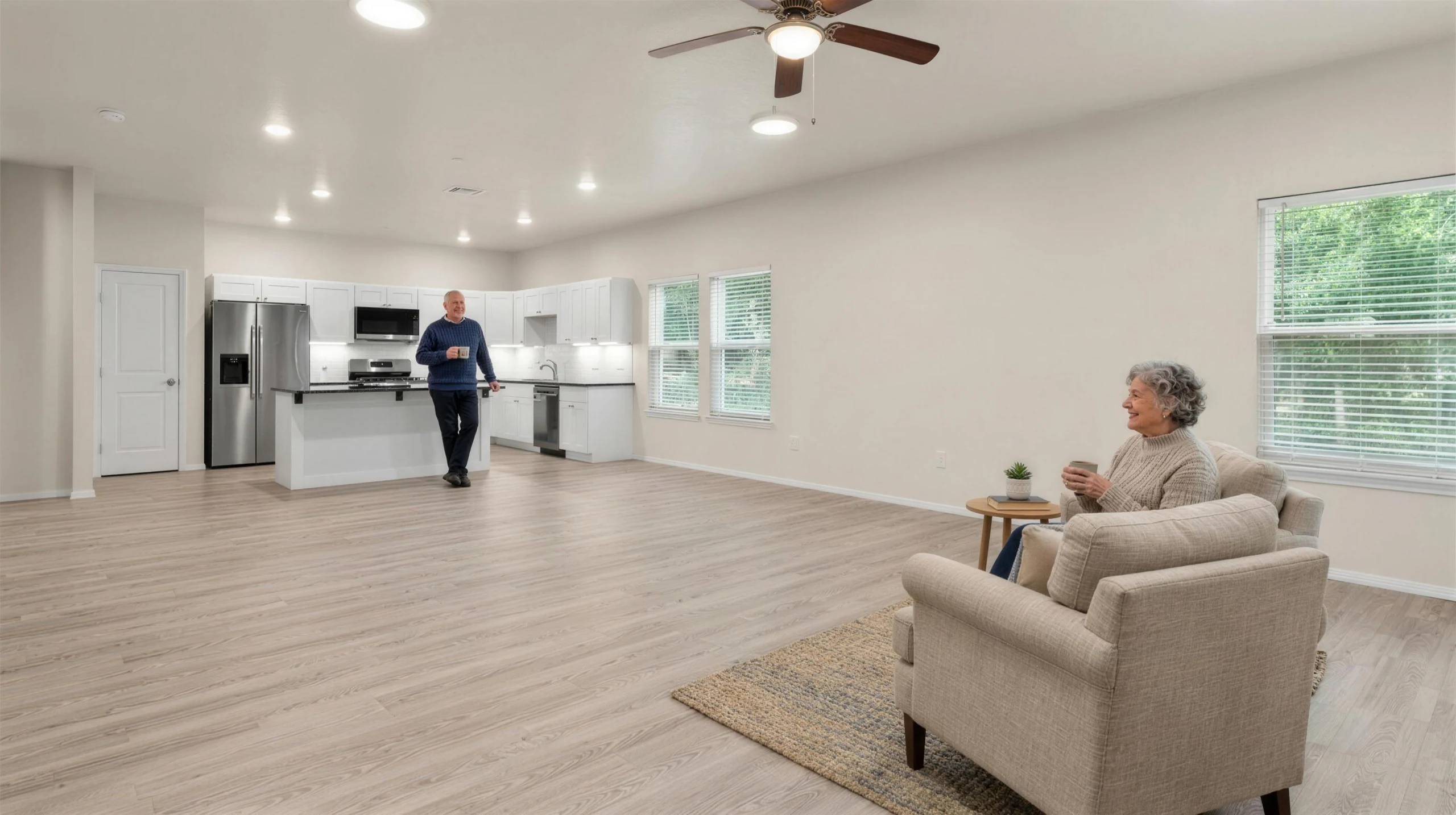 A couple enjoying morning coffee in an open-plan Meadow Hills living room